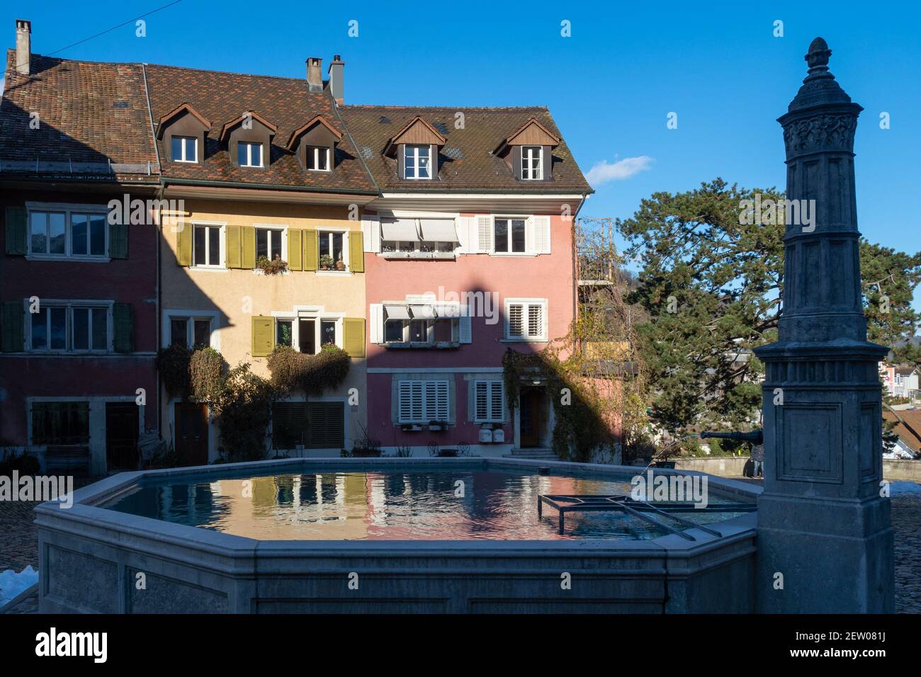 Brugg AG, Switzerland - January 1st 2021: Historic centre: Fountain and houses Stock Photo