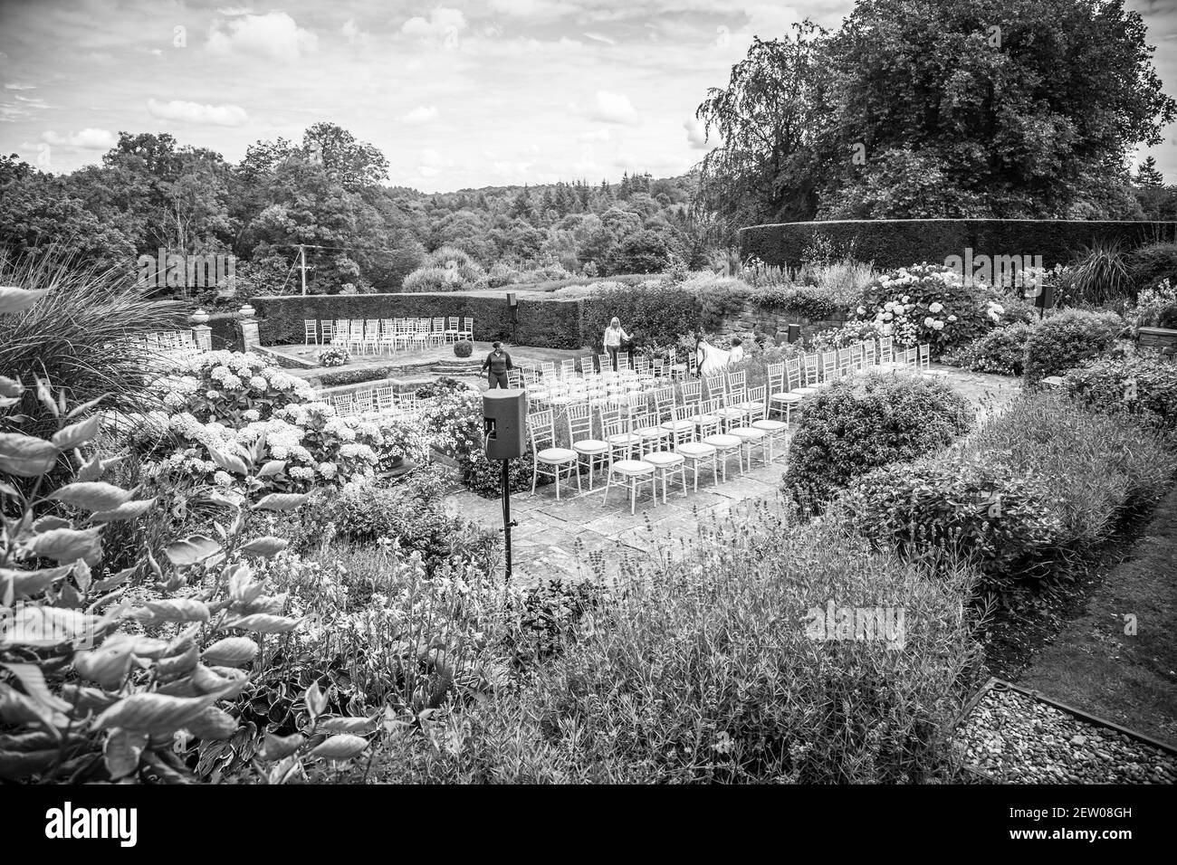 Seating set-up in the sunken garden of a mansion house ready for the guests to arrive. Stock Photo