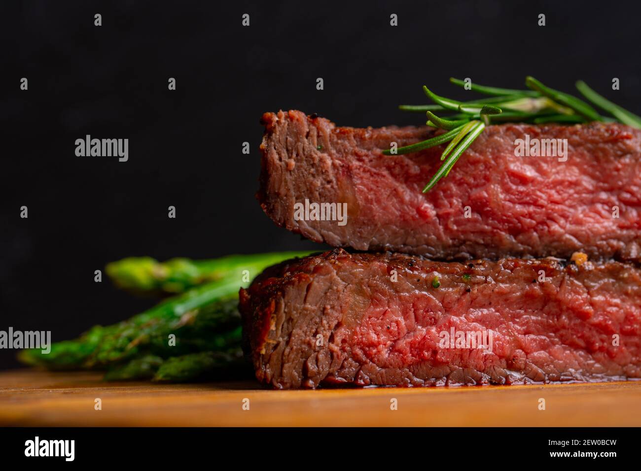 grilled venison fillet on wooden table close up Stock Photo