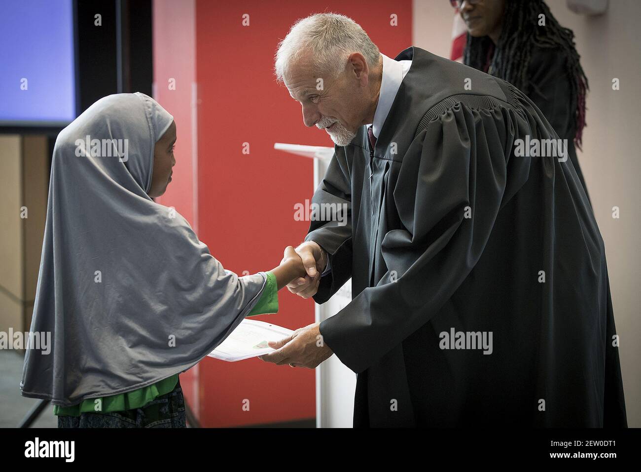 U S Magistrate Judge David T Schultz District Of Minnesota Presents Certificates Of Citizenship To 23 Children During A U S Citizenship And Immigration Services Citizenship Ceremony At The Minnesota Children S Museum Friday July
