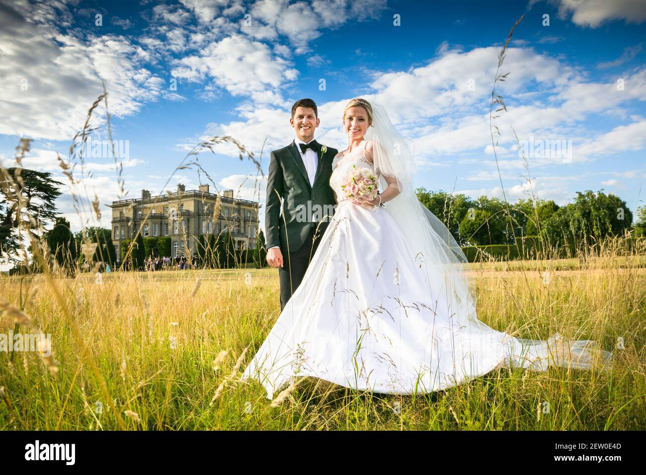 Bride and Bridegroom looking very happy and in love on their wedding day Stock Photo