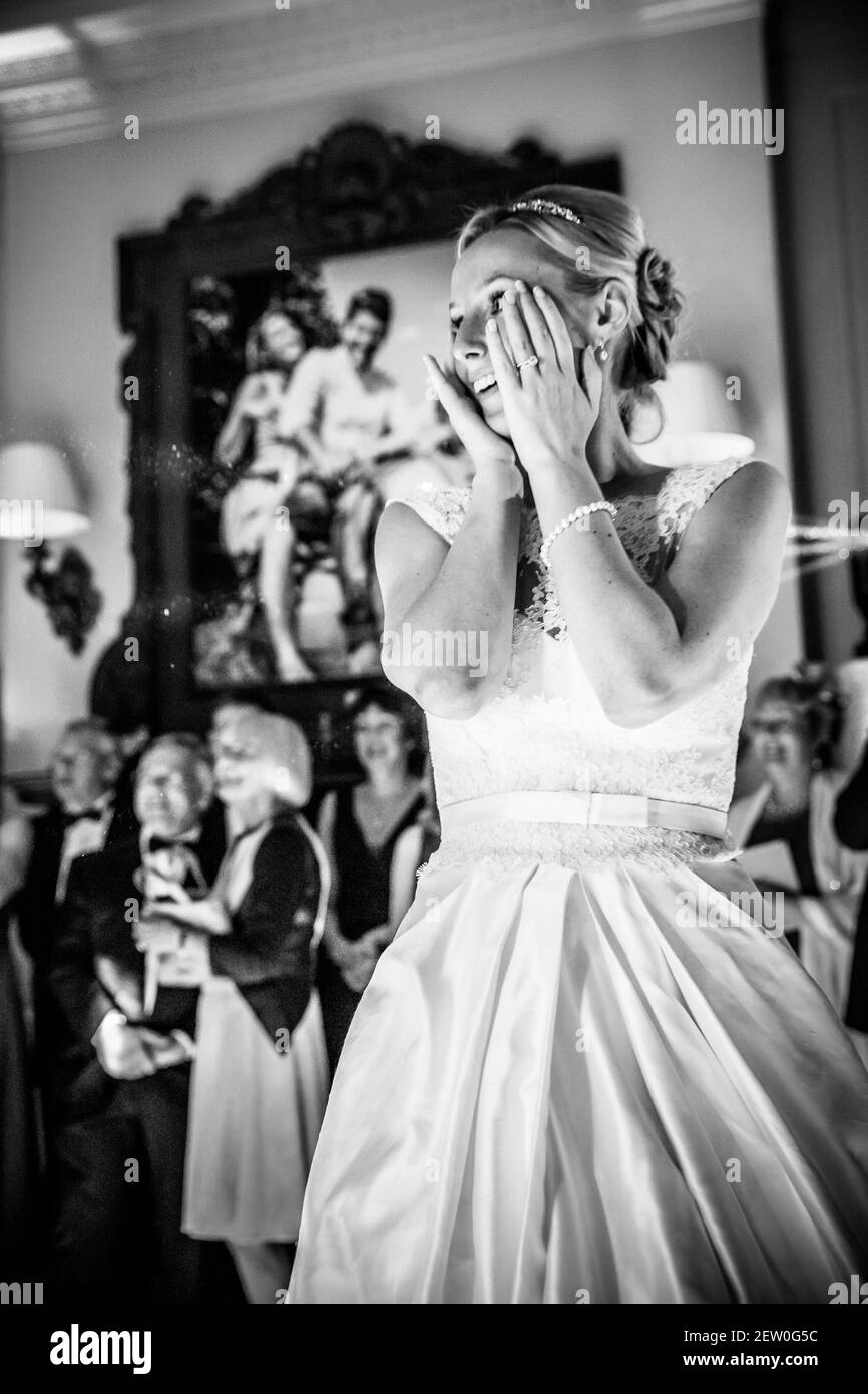 Bride on the dance floor with onlooking guests. Stock Photo
