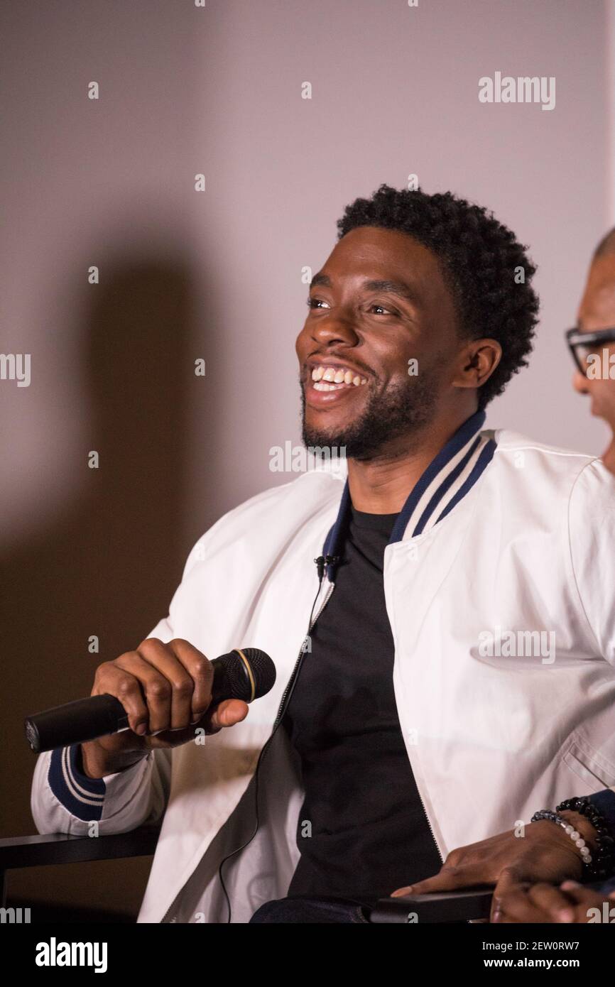 L-R); Moderator Roland Martin, host of TV One's "News One Now", lead actor  Chadwick Boseman, and Director Reginald Hudlin, participate in a Q&A after  the advance screening of the movie "Marshall", a