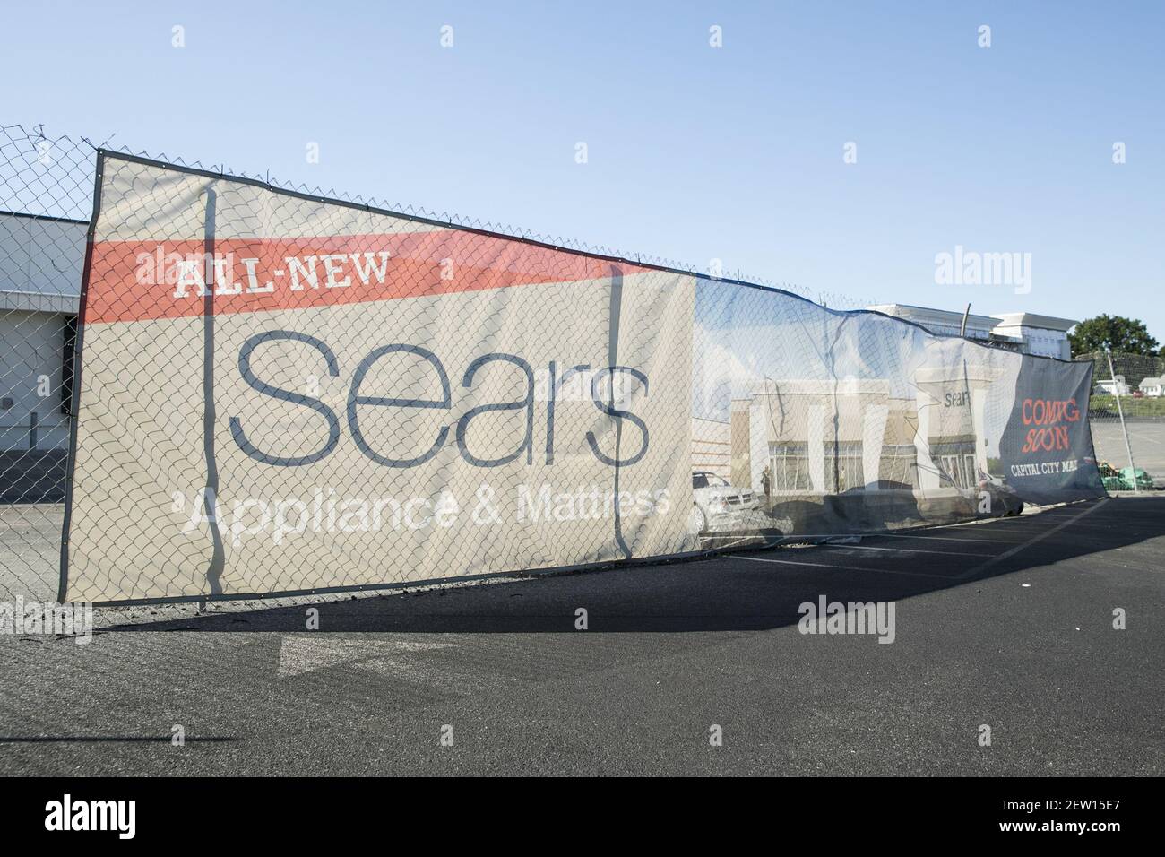 A banner advertising a soon to open Sears Appliance and Mattress store