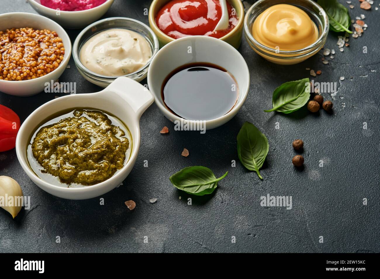 Set of sauces in bowls - ketchup, mayonnaise, mustard, soy sauce, bbq ...