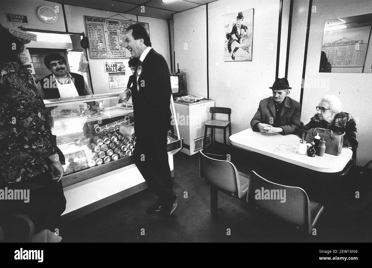 Jack Cunningham chats to staff at Dots Cafe in Tooting Bec Stock Photo