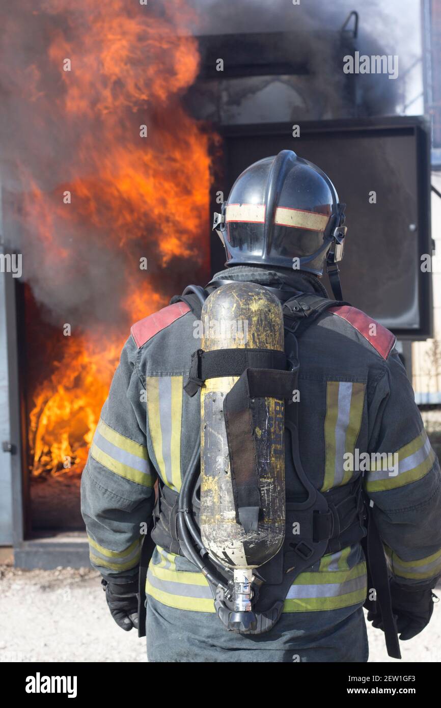 Firefighter putting out fire training station extinguisher backdraft ...