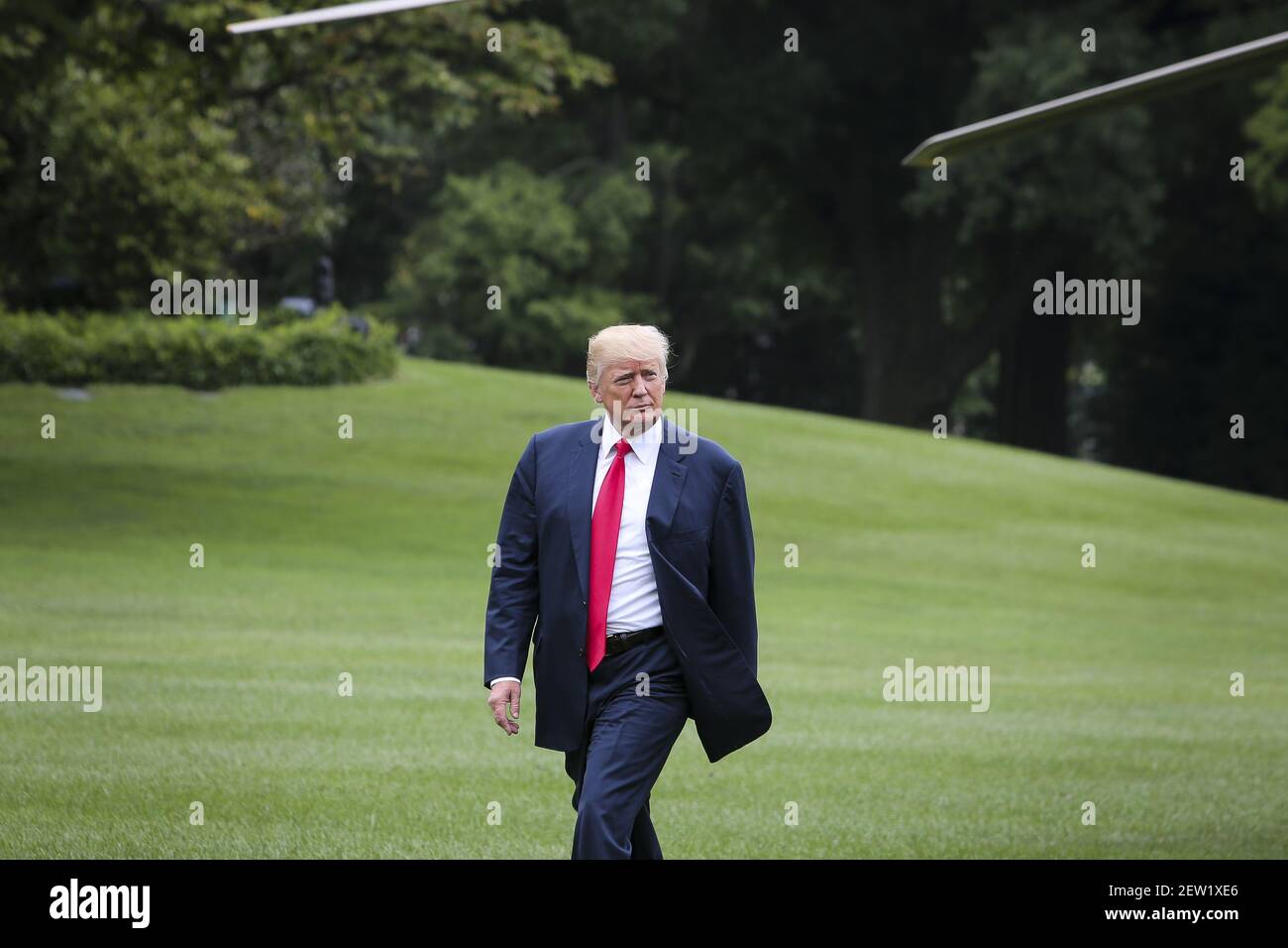President Donald Trump arrives on the South Lawn at the White House on ...