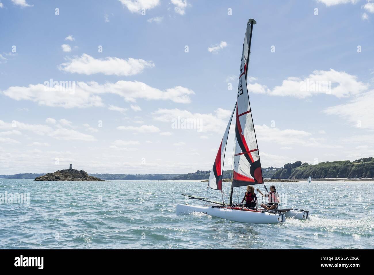 France, Côtes d'Armor, Saint-Quay-Portrieuc, Saint-Quay sailing school catamaran in action Stock Photo