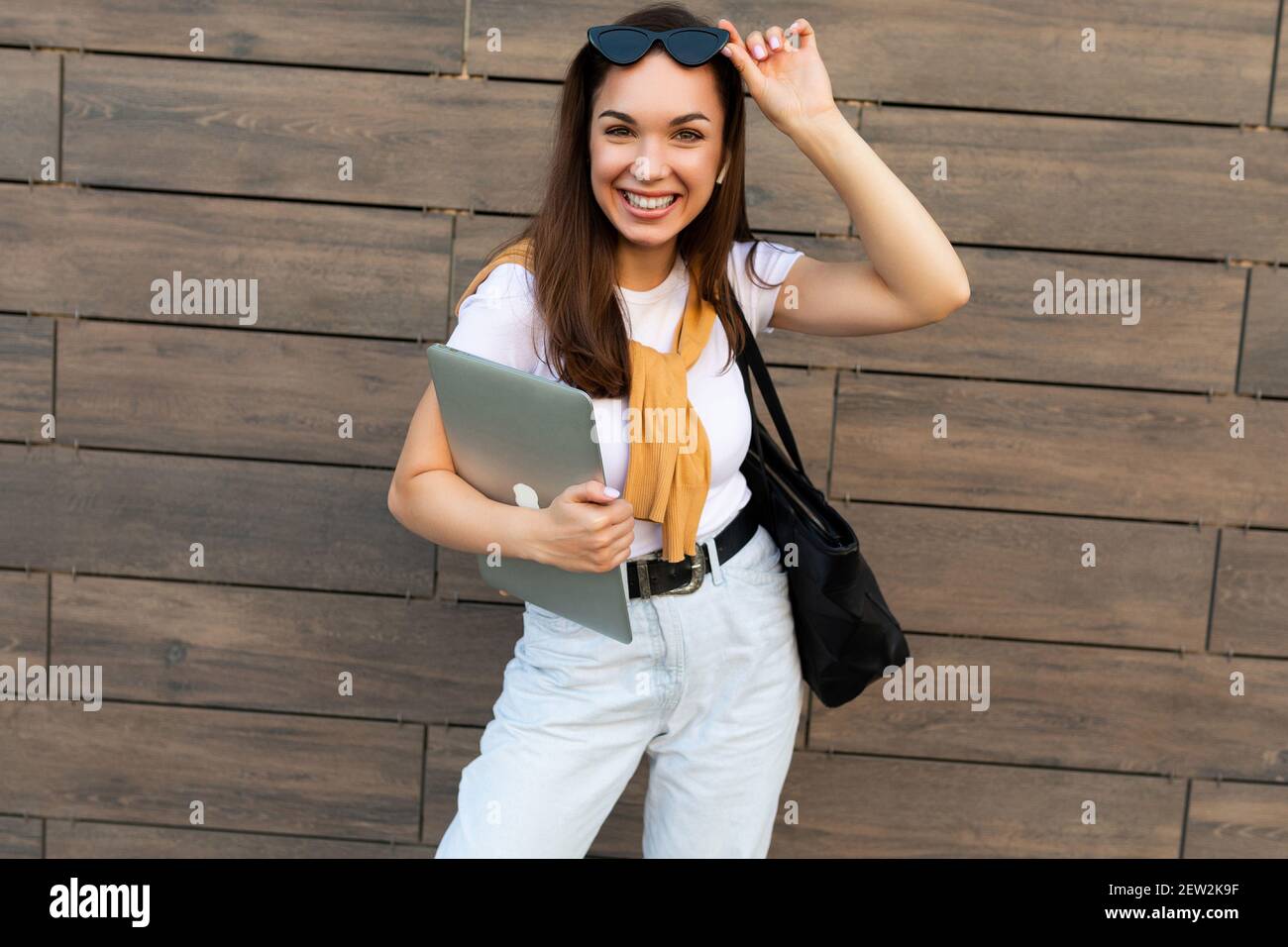 holding computer laptop Stock Photo 