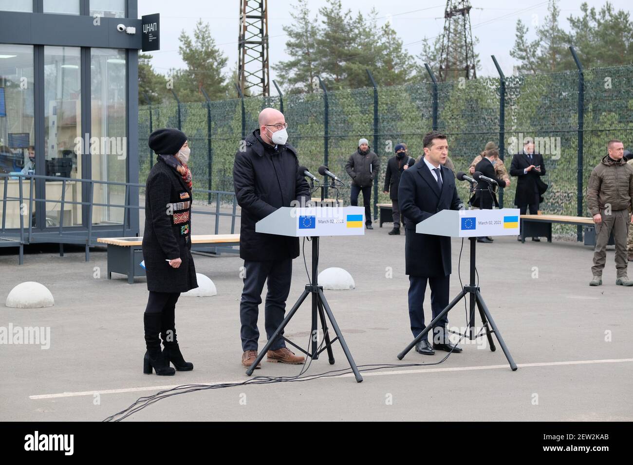KYIV, UKRAINE - MARCH 2, 2021 - President of the European Council Charles Michel (C) and President of Ukraine Volodymyr Zelenskyy (R) hold a joint briefing at the Shchastia entry-exit checkpoint, Luhansk Region, eastern Ukraine. Stock Photo
