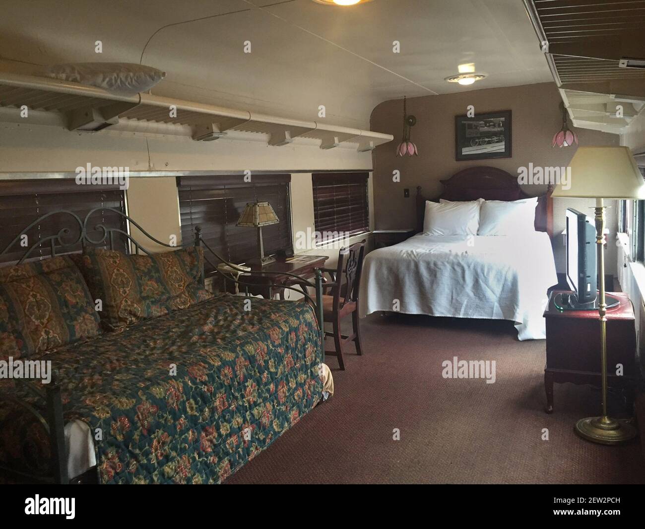 The Interior Of A Pullman Train Car That Has Been Converted Into A Hotel Room At The Chattanooga Choo Choo Hotel This Room Included A Queen Sized Bed And A Daybed With A