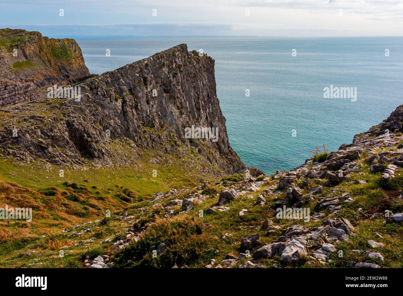Rocky cliffs at Mewslade Bay near Worms Head on the western side of the Gower Peninsula near Swansea South Wales UK Stock Photo