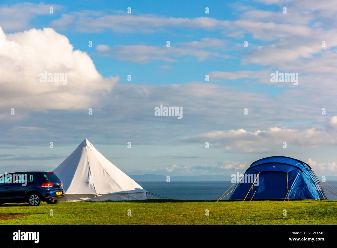 View of the campsite on the cliff top at Three Cliffs Bay on the south coast of the Gower Peninsula near Swansea in South Wales UK Stock Photo