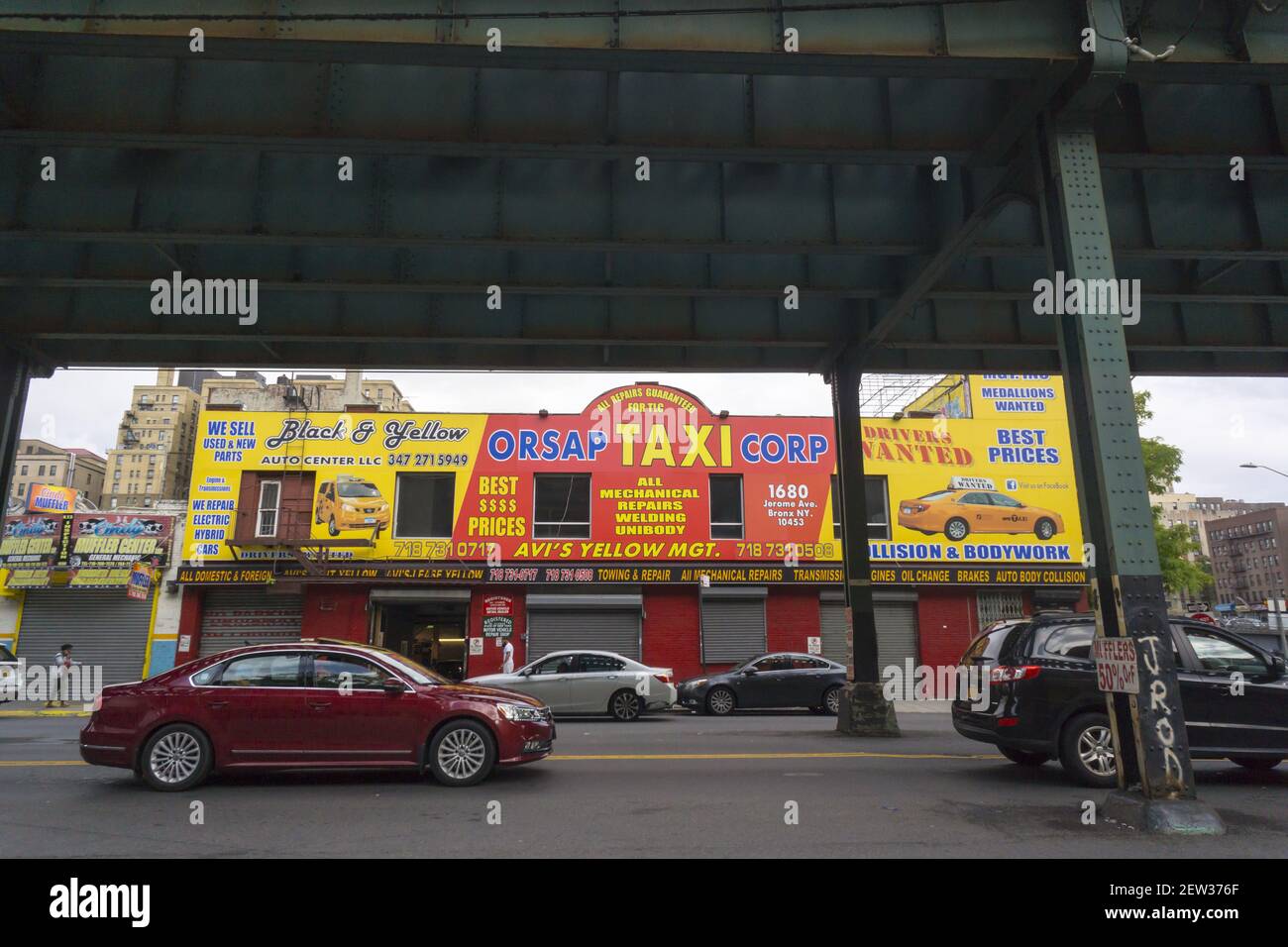 Taxi garage under the elevated train along Jerome Avenue in the Bronx  borough of New York is seen on Sunday, September 3, 2017. (© Richard B.  Levine Stock Photo - Alamy