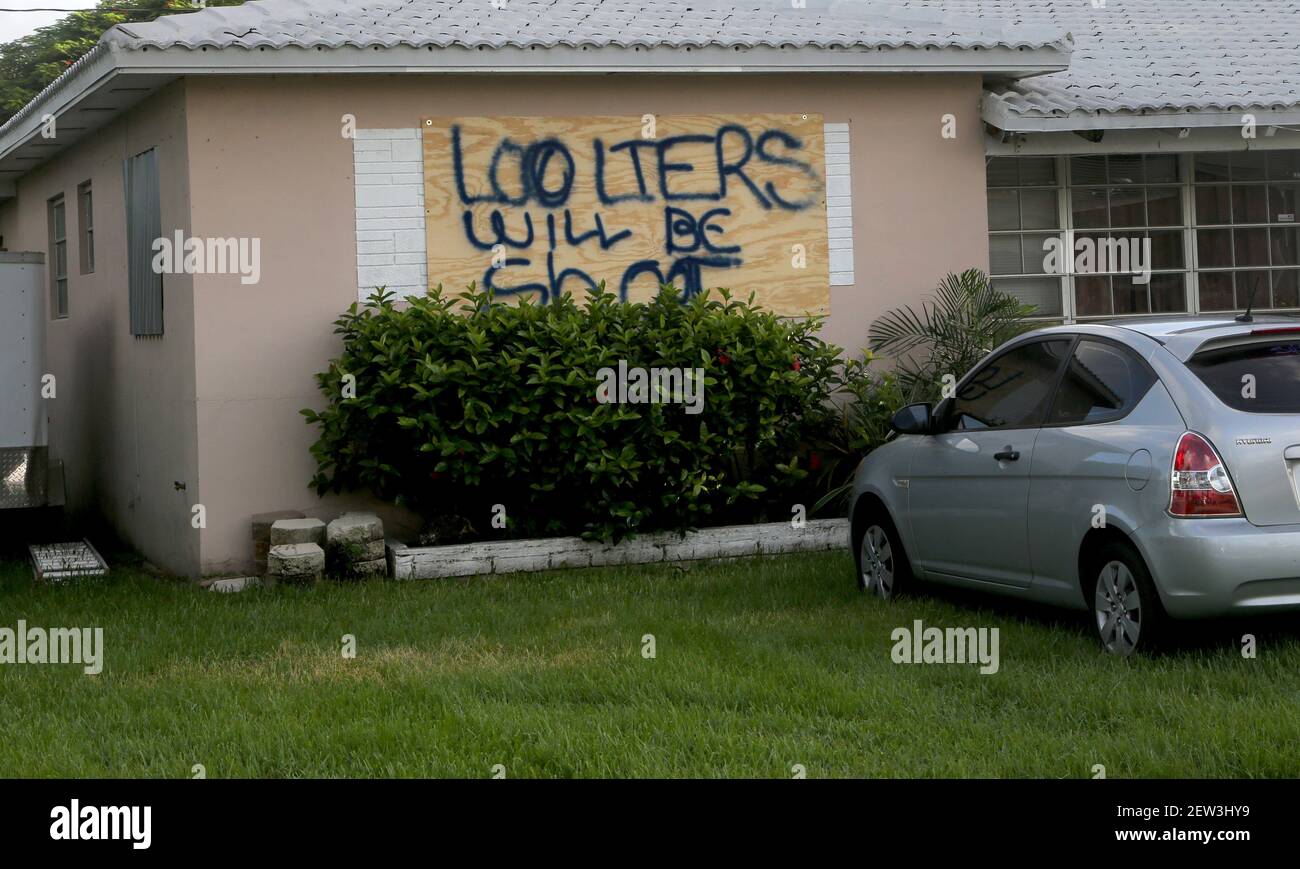 A homeowner in Dania Beach has a stern warning painted on his boarded