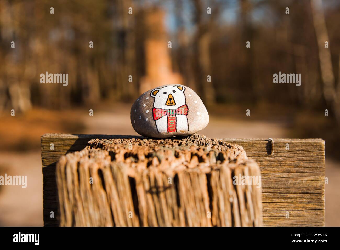 Rock painting, animal painted pebble, polar bear, Ockham Common Forest, Surrey UK 2021 February winter Stock Photo
