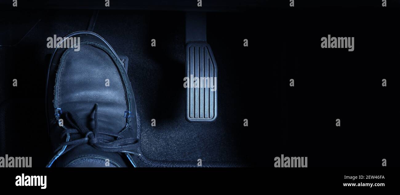 Accelerator and breaking pedal in a car. Close up the foot pressing foot  pedal of a car to drive ahead. Driver driving the car by pushing accelerator  Stock Photo - Alamy