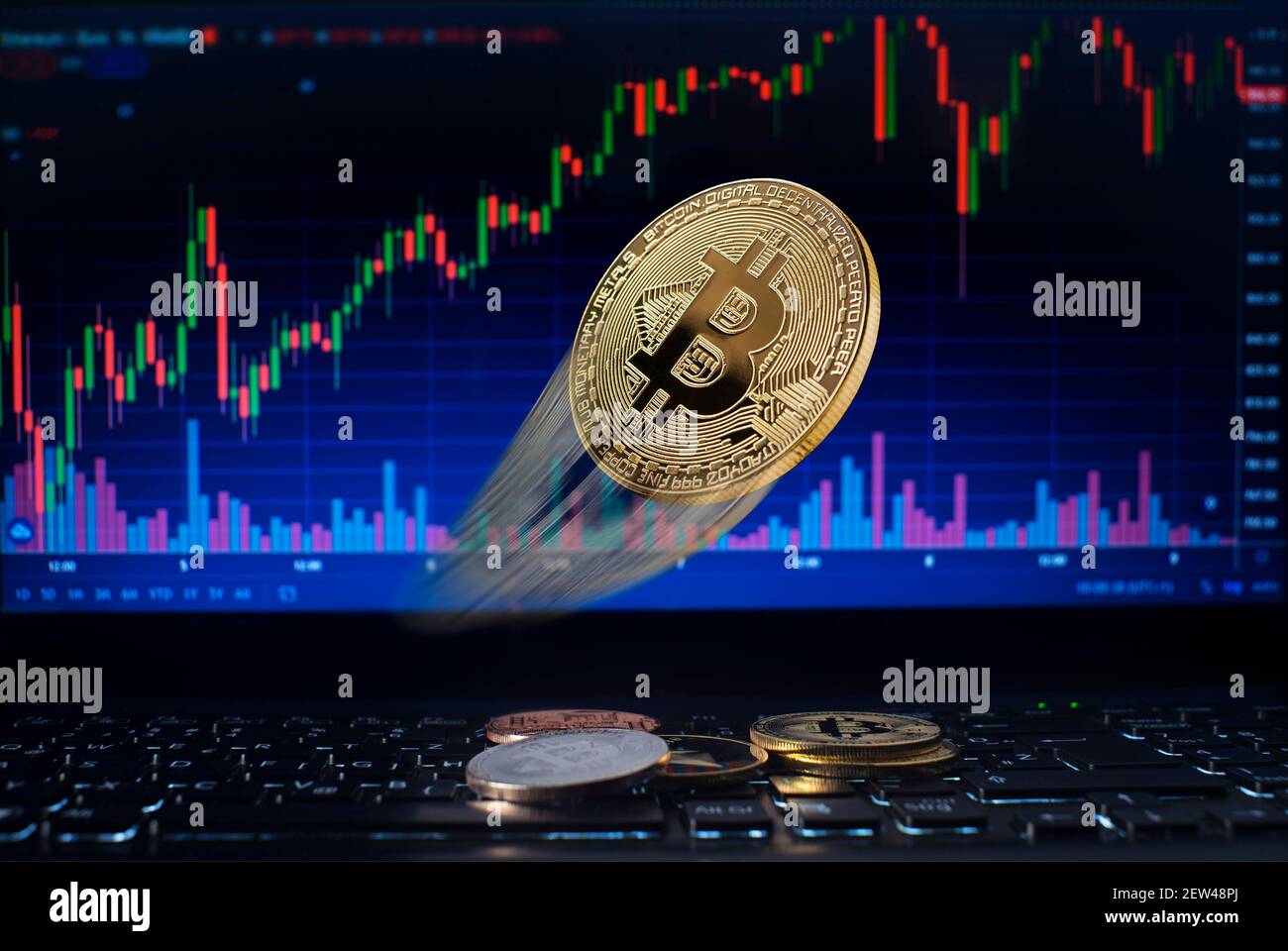 Golden bitcoin flying whit computer trading chart background. Bitcoin and altcoin the most important cryptocurrency concept Stock Photo