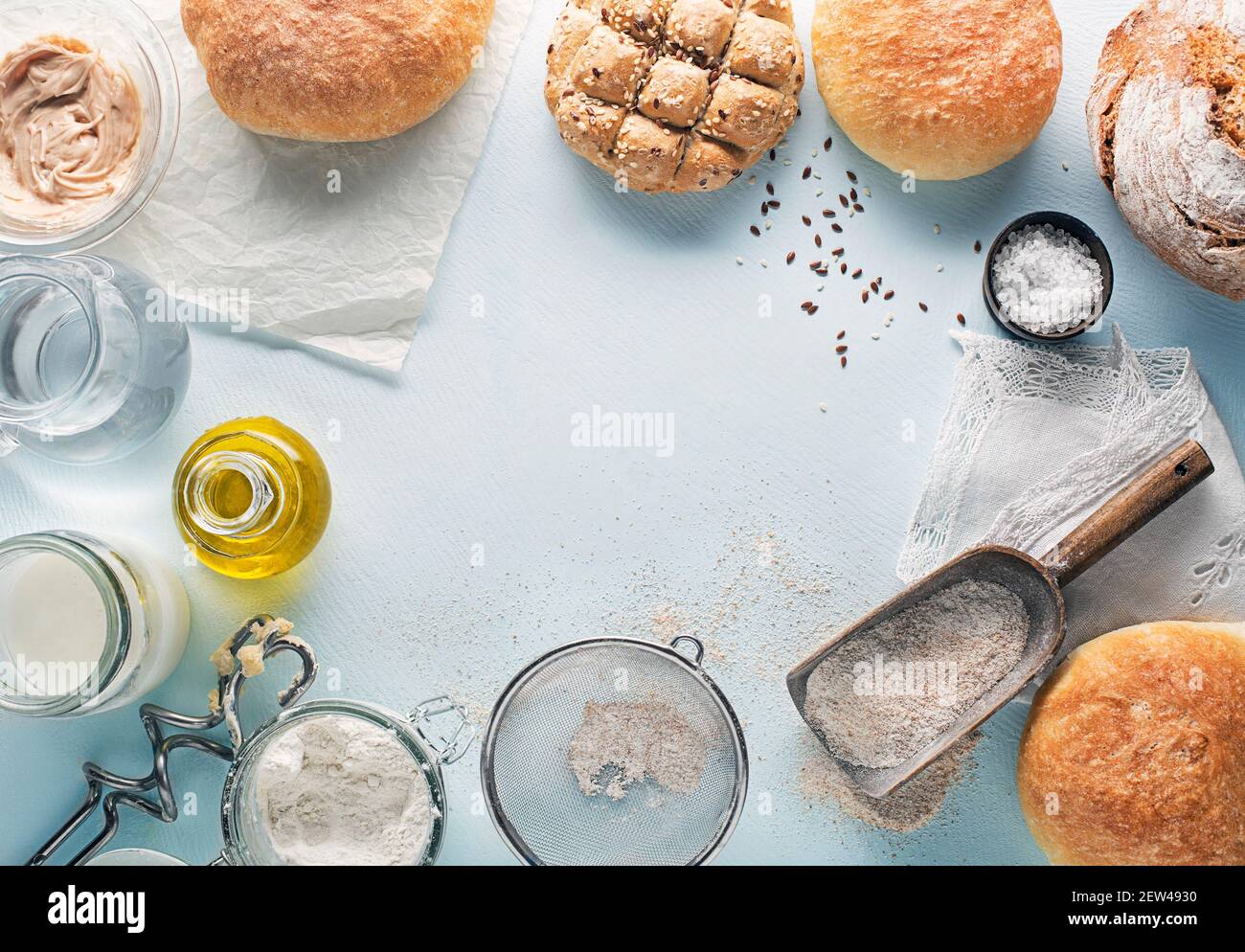 Ingredients for making and baking homemade bread on blue table background Stock Photo