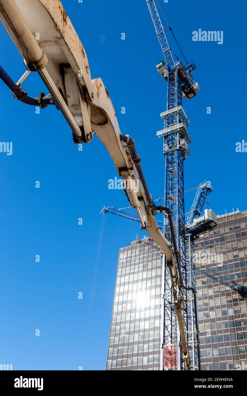 Boom arm concrete supply, building site, UK Stock Photo