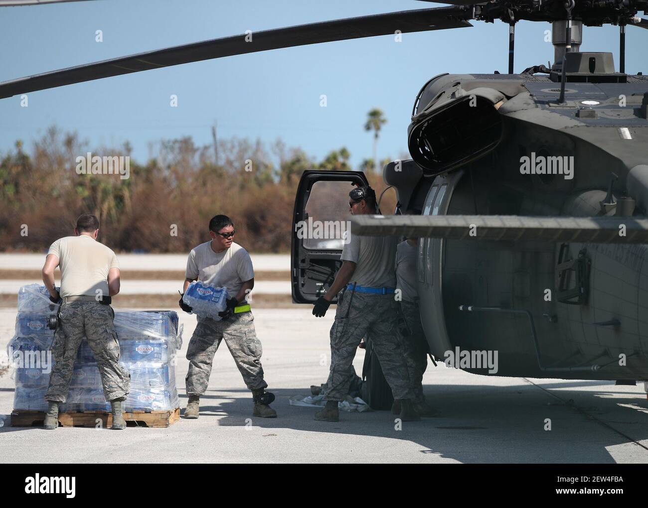 Soldiers and Airmen from the Florida Army National Guard load bottled