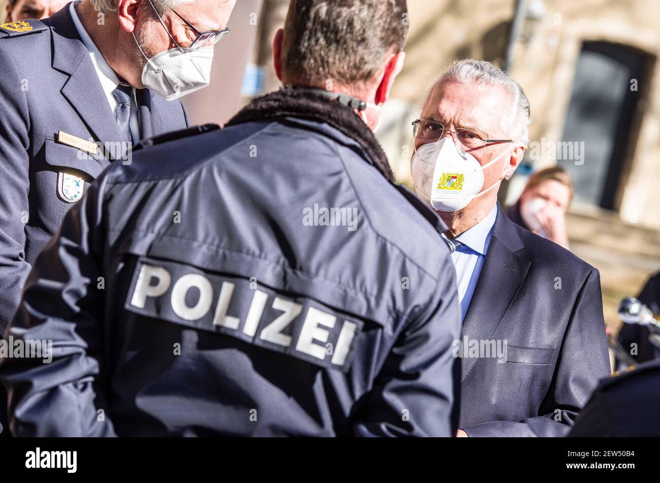 Munich, Bavaria, Germany. 2nd Mar, 2021. JOACHIM HERRMANN, Interior Minister of Bavaria meeting with police officers to kick off the Covid vaccination program. Starting with some 10,000 doses of the AstraZeneca Covid-19 vaccine, the Bavarian Police has begun vaccinating its Bereitschaftspolizei and Einsatzeinheiten- specialized police units that deal with demonstrations, riots, and other missions. Germany's vaccine program has been criticized for being extremely slow, with numerous nations surpassing not only percentage of the population vaccinated, but also absolute numbers as they vaccin Stock Photo