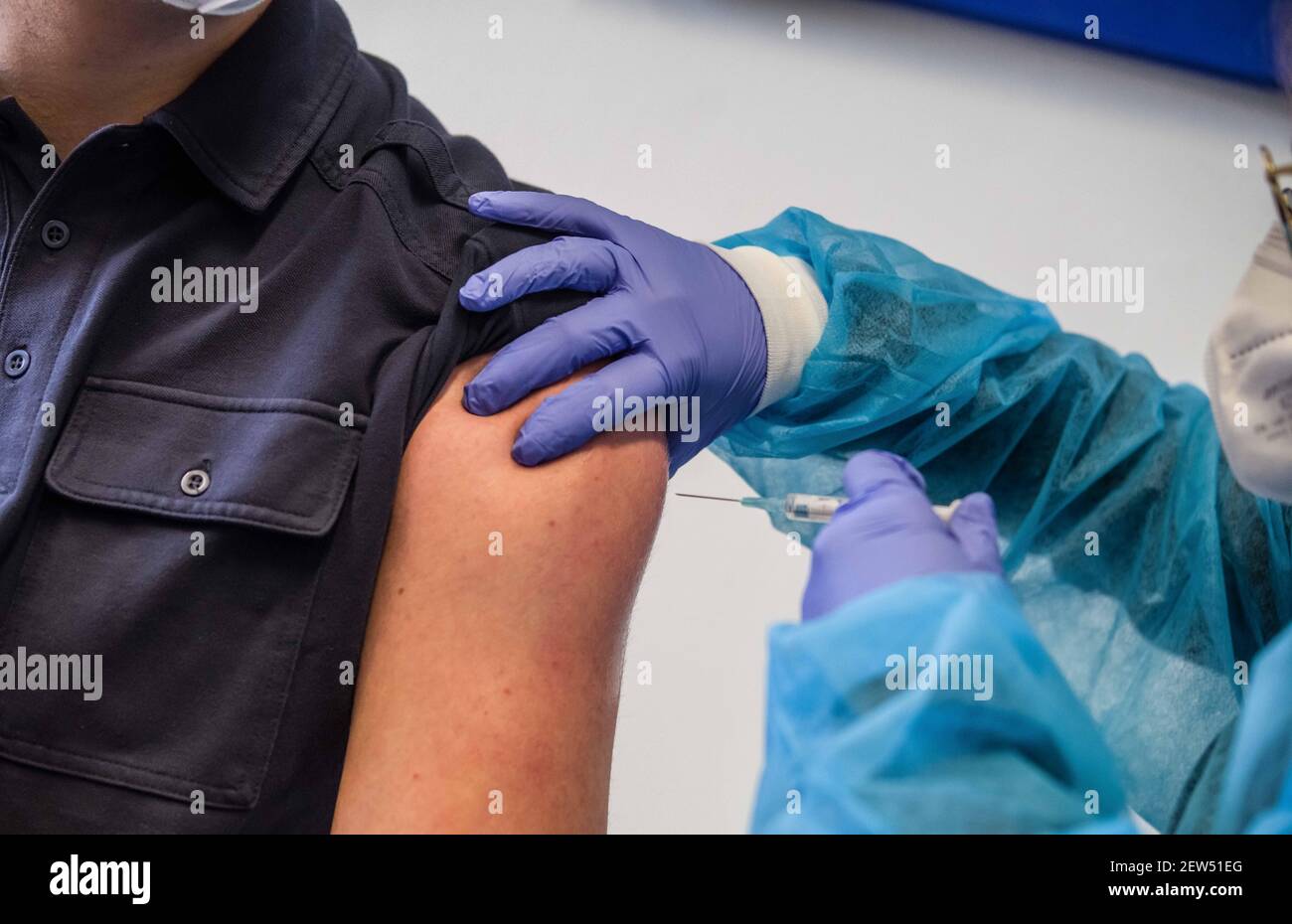 Munich, Bavaria, Germany. 2nd Mar, 2021. The administration of the AstraZeneca Covid vaccine to Munich Police. Starting with some 10,000 doses of the AstraZeneca Covid-19 vaccine, the Bavarian Police has begun vaccinating its Bereitschaftspolizei and Einsatzeinheiten- specialized police units that deal with demonstrations, riots, and other missions. Germany's vaccine program has been criticized for being extremely slow, with numerous nations surpassing not only percentage of the population vaccinated, but also absolute numbers as they vaccinate those at risk and simultaneously the general Stock Photo