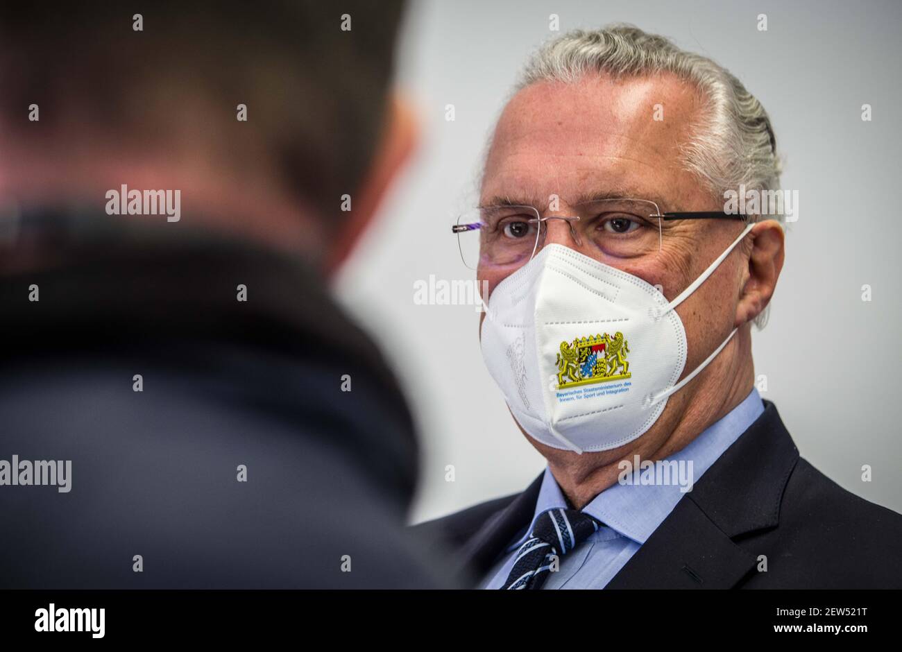 Munich, Bavaria, Germany. 2nd Mar, 2021. JOACHIM HERRMANN, Interior Minister of Bavaria meeting with police officers to kick off the Covid vaccination program. Starting with some 10,000 doses of the AstraZeneca Covid-19 vaccine, the Bavarian Police has begun vaccinating its Bereitschaftspolizei and Einsatzeinheiten- specialized police units that deal with demonstrations, riots, and other missions. Germany's vaccine program has been criticized for being extremely slow, with numerous nations surpassing not only percentage of the population vaccinated, but also absolute numbers as they vaccin Stock Photo