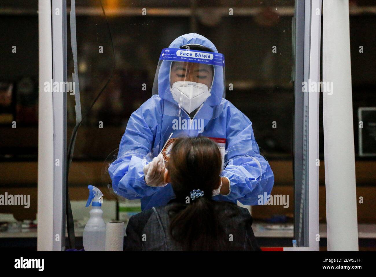 A medical worker wearing full personal protective equipment (PPE