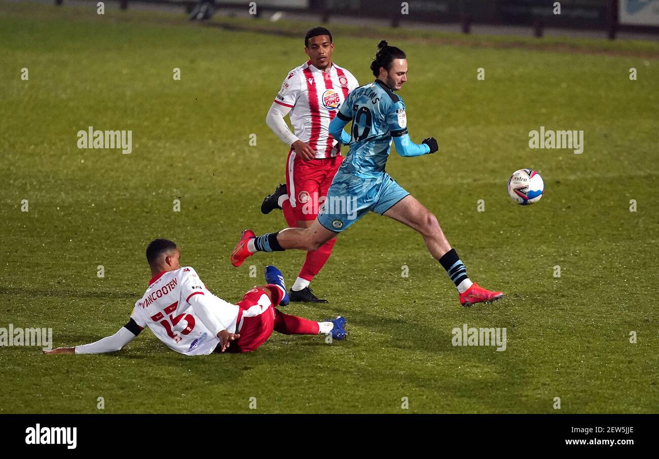 Forest Green Rovers' Aaron Collins jumps the tackle from Stevenage's Terence Vancooten during the Sky Bet League Two match at the Lamex Stadium, Stevenage. Picture date: Tuesday March 2, 2021. Stock Photo