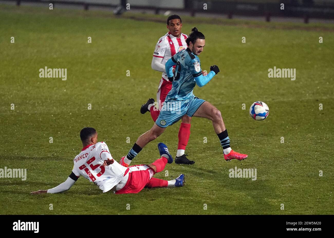 Forest Green Rovers' Aaron Collins jumps the tackle from Stevenage's Terence Vancooten during the Sky Bet League Two match at the Lamex Stadium, Stevenage. Picture date: Tuesday March 2, 2021. Stock Photo