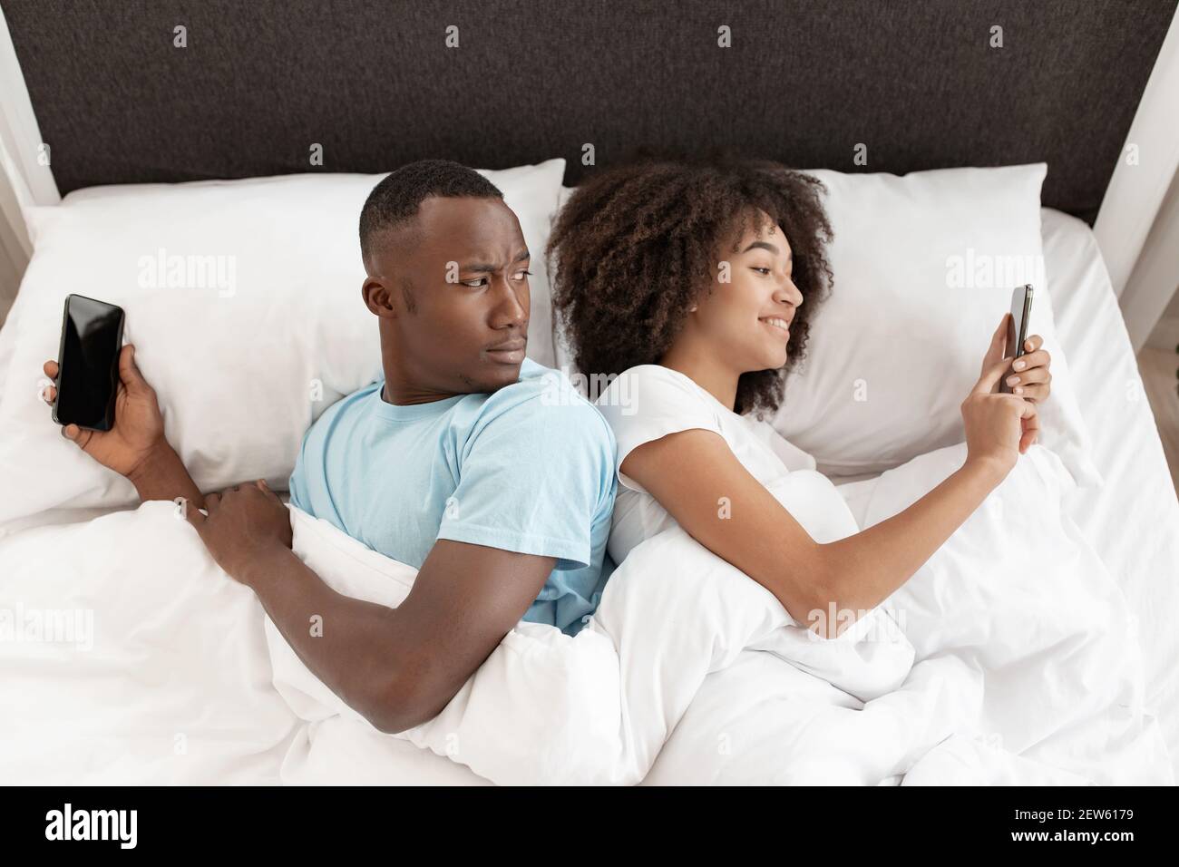 Cheating, infidelity, suspicion, technology and relationship problems Stock Photo