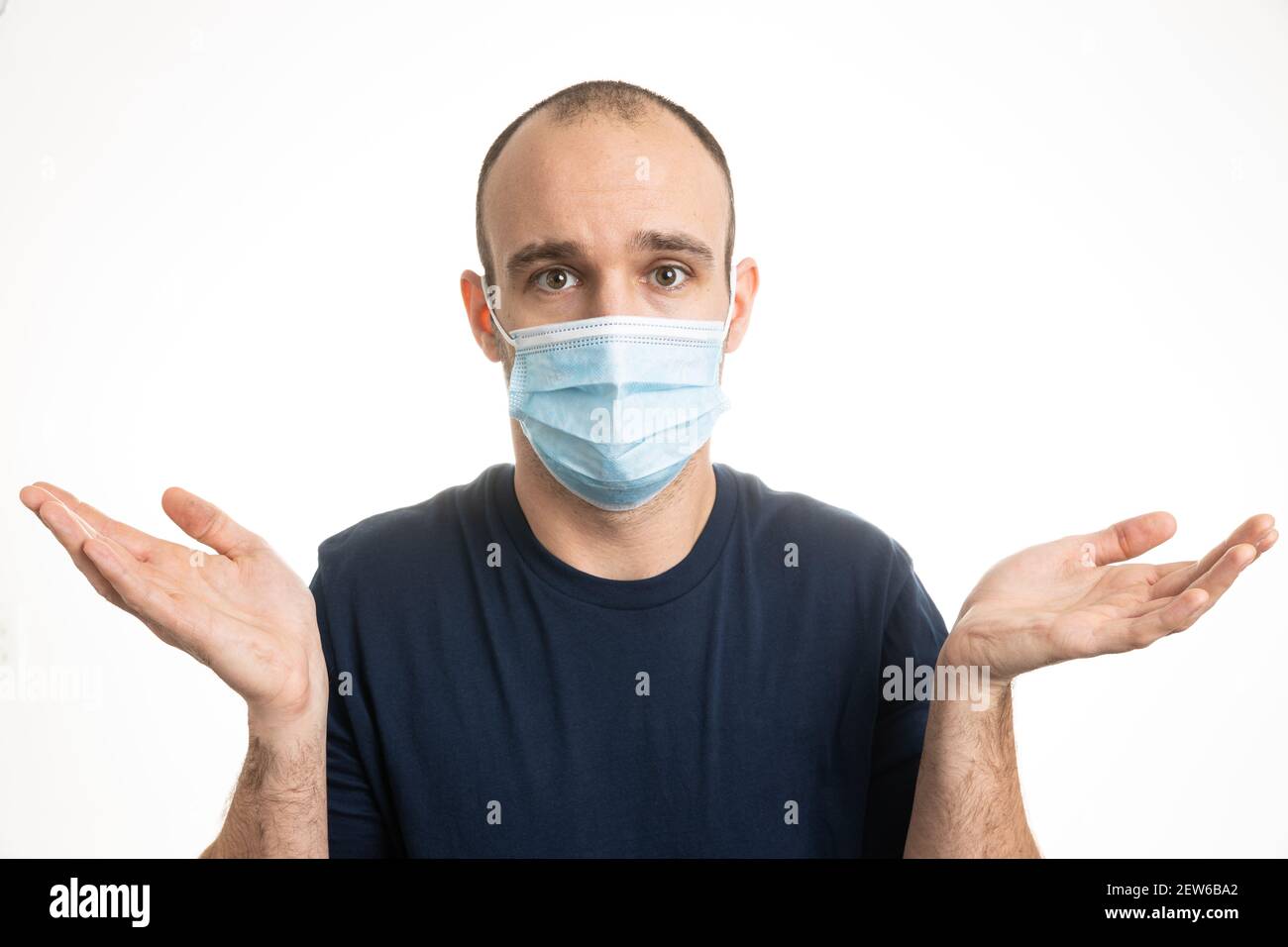 A middle aged, Caucasian male wearing a blue tshirt and blue surgical