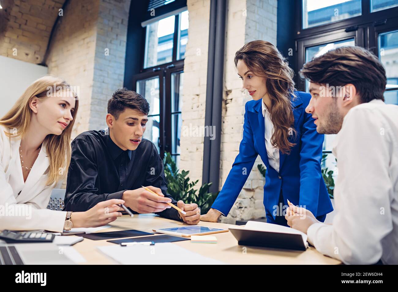 businesspeople discussing at table in office Stock Photo