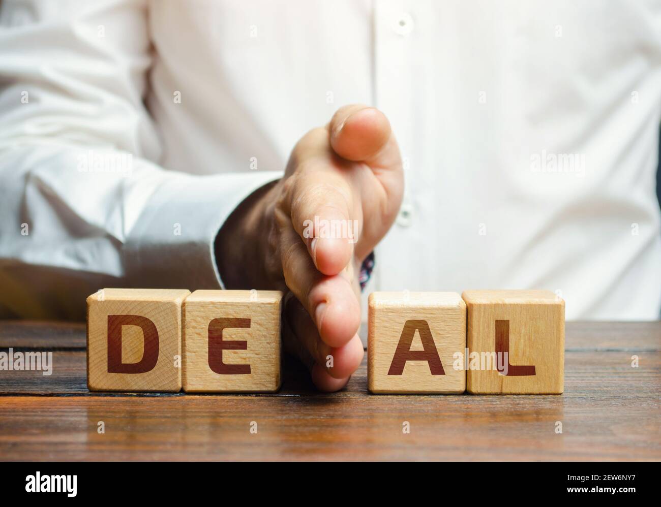 Man divide blocks with word deal. Breaking contract agreements, termination of cooperation. Violation of conditions and rules. Completion of the agree Stock Photo