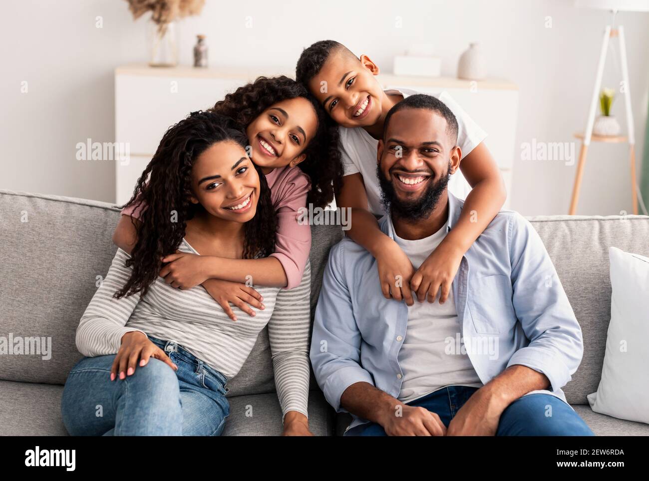 Portrait of a happy black family posing at camera Stock Photo - Alamy
