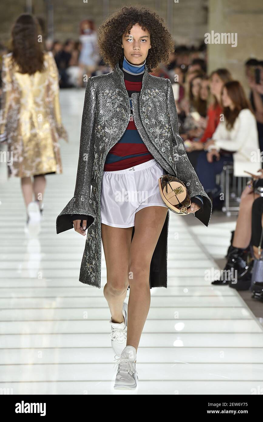 A model walks on the runway at the Louis Vuitton fashion show