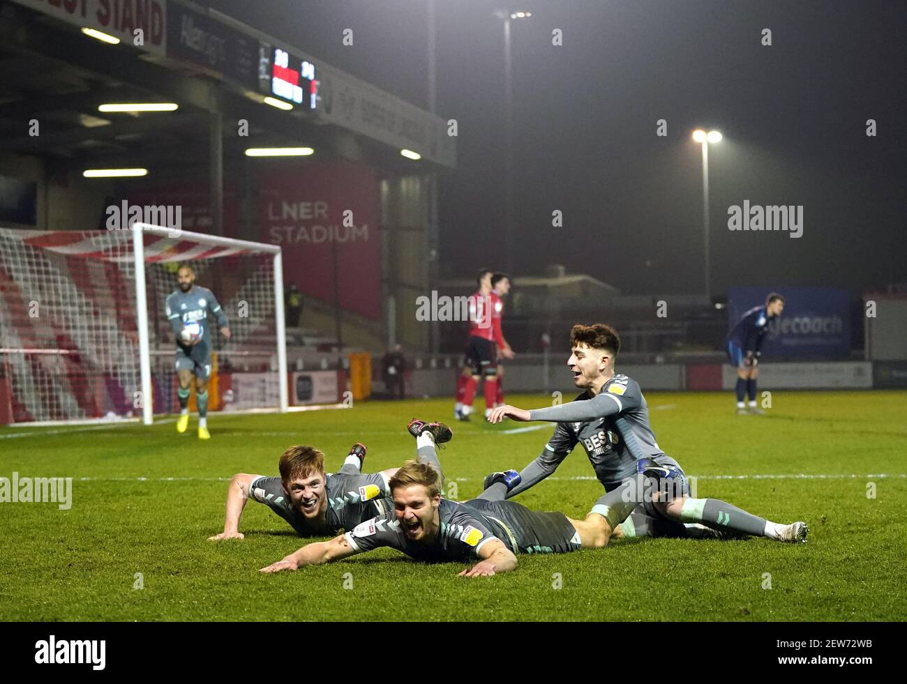 Fleetwood Town's Callum Camps celebrates with teammates after scoring his sides second goal during the Sky Bet League One match at the LNER Stadium, Lincoln. Picture date: Tuesday March 2, 2021. Stock Photo