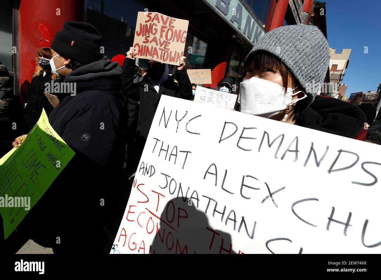 Demonstrators from 318 restaurant workers union hold up placards during a demonstration against the closure of Jing Fong restaurant in Chinatown. Recent extraordinary rental demands placed by Jonathan Chu, the biggest landlord in Chinatown, on small business has forced many to shutter their doors. Such demands have forced Jing Fong restaurant to end operations by March 7, 2021. Stock Photo