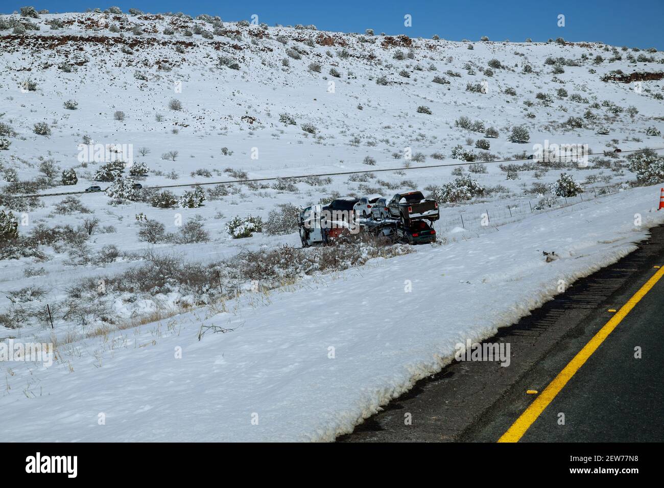 Drift of the car carrier trailer truck on the winter road because of snowy mountain road in winter Stock Photo