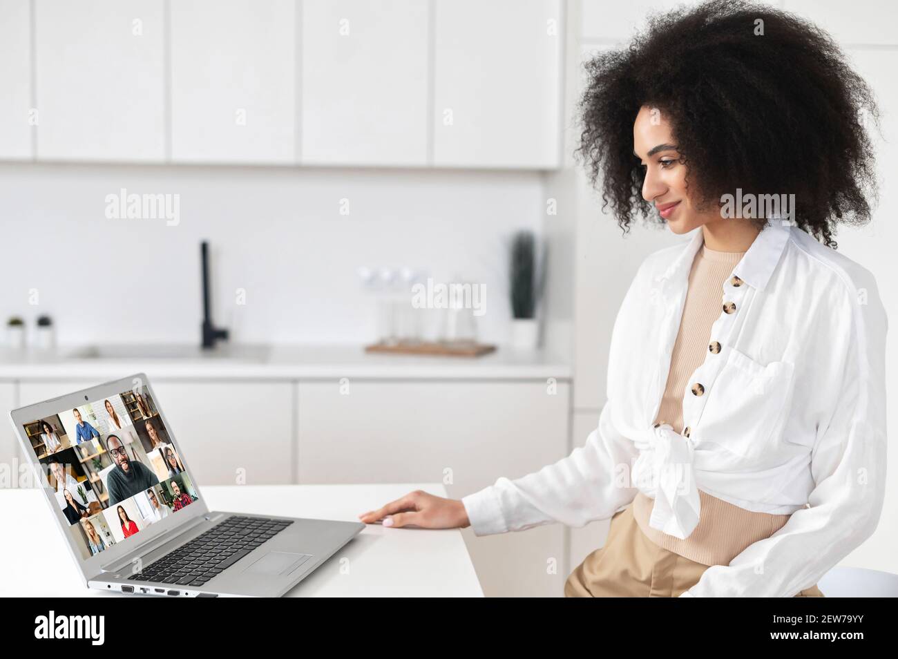 African American Female Freelancer Or Business Owner With Curly Hair Using App For Distance Video Communication