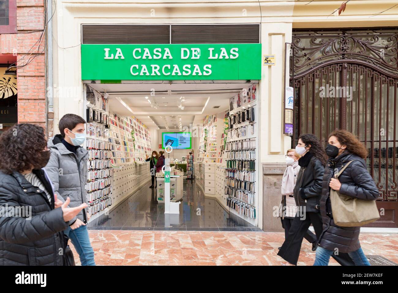 People walk past the La Casa de las Carcasas store. (Photo by Xisco Navarro  / SOPA Images/Sipa USA Stock Photo - Alamy