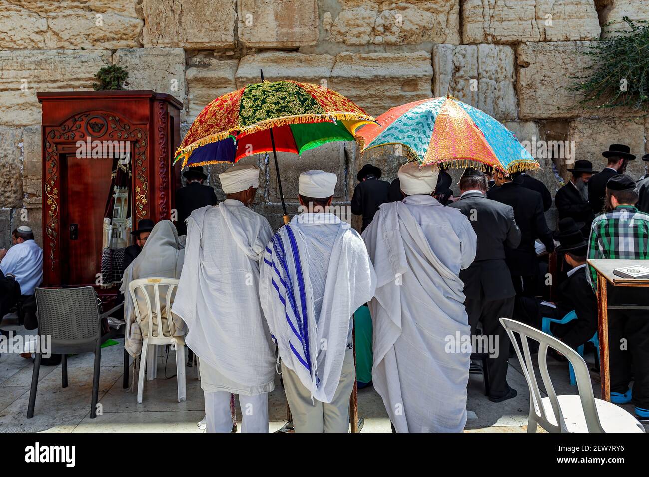 People praying at Western Wall in Jerusalem on Tisha B'Av - annual fast day in Judaism. Stock Photo