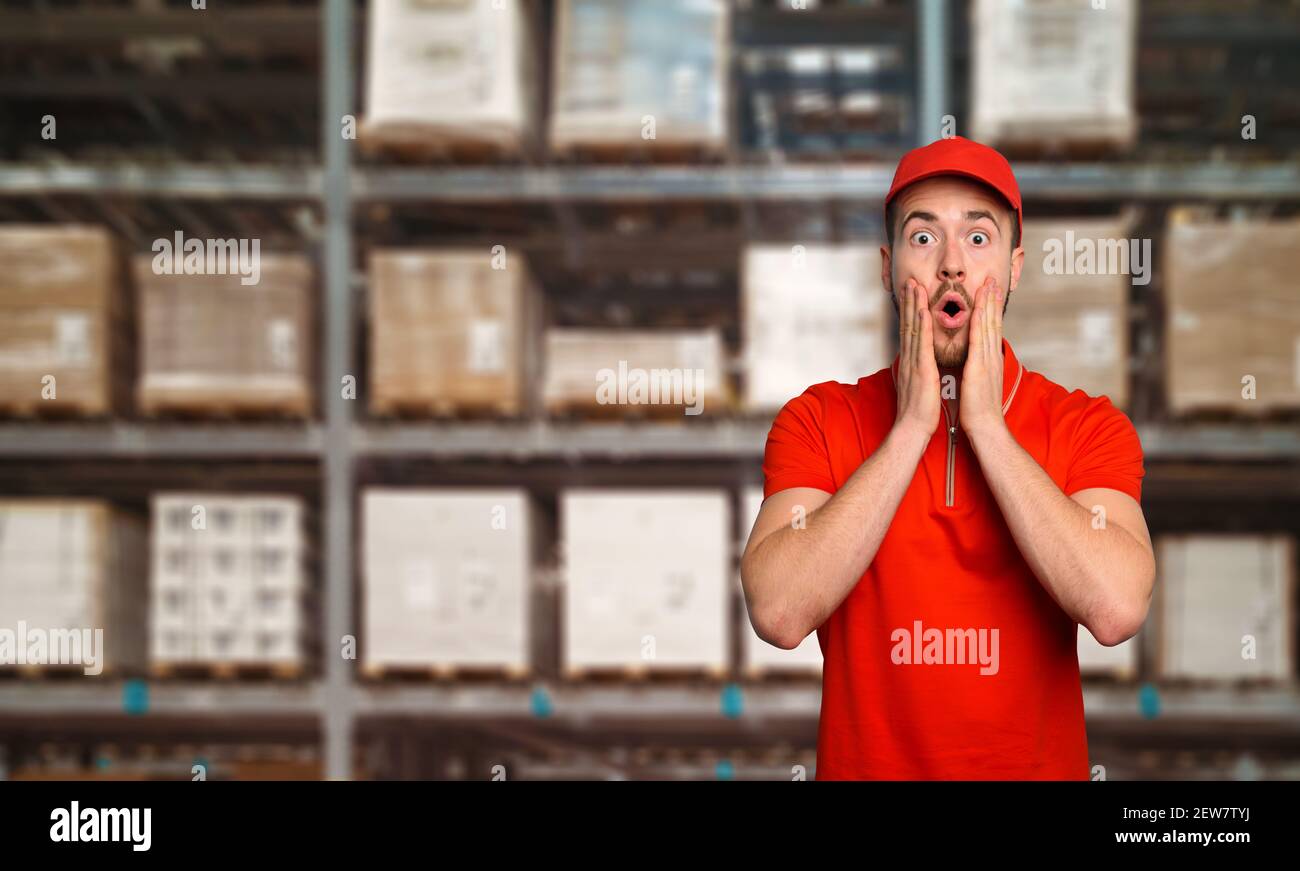 Courier at work has a wondered expression about a great promotion Stock Photo