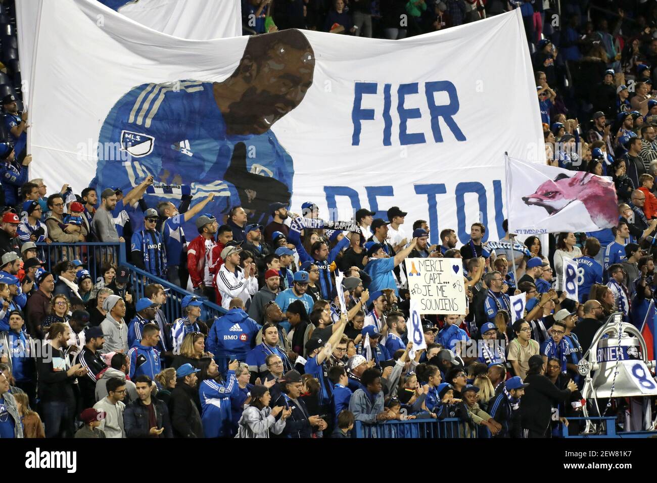 Oct 22, 2017; Montreal, Quebec, CAN; Montreal Impact fans hold a sign "We  are proud of you" (Fier de toi) after the game against New England  Revolution at Stade Saputo. Mandatory Credit: