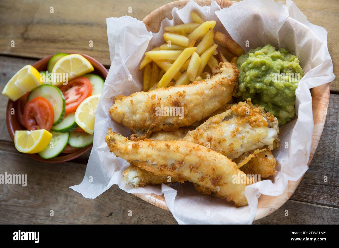 Fillets from whiting, Merlangus merlangius, that were line caught in the English Channel. They have been battered and deep fried to make a homemade po Stock Photo