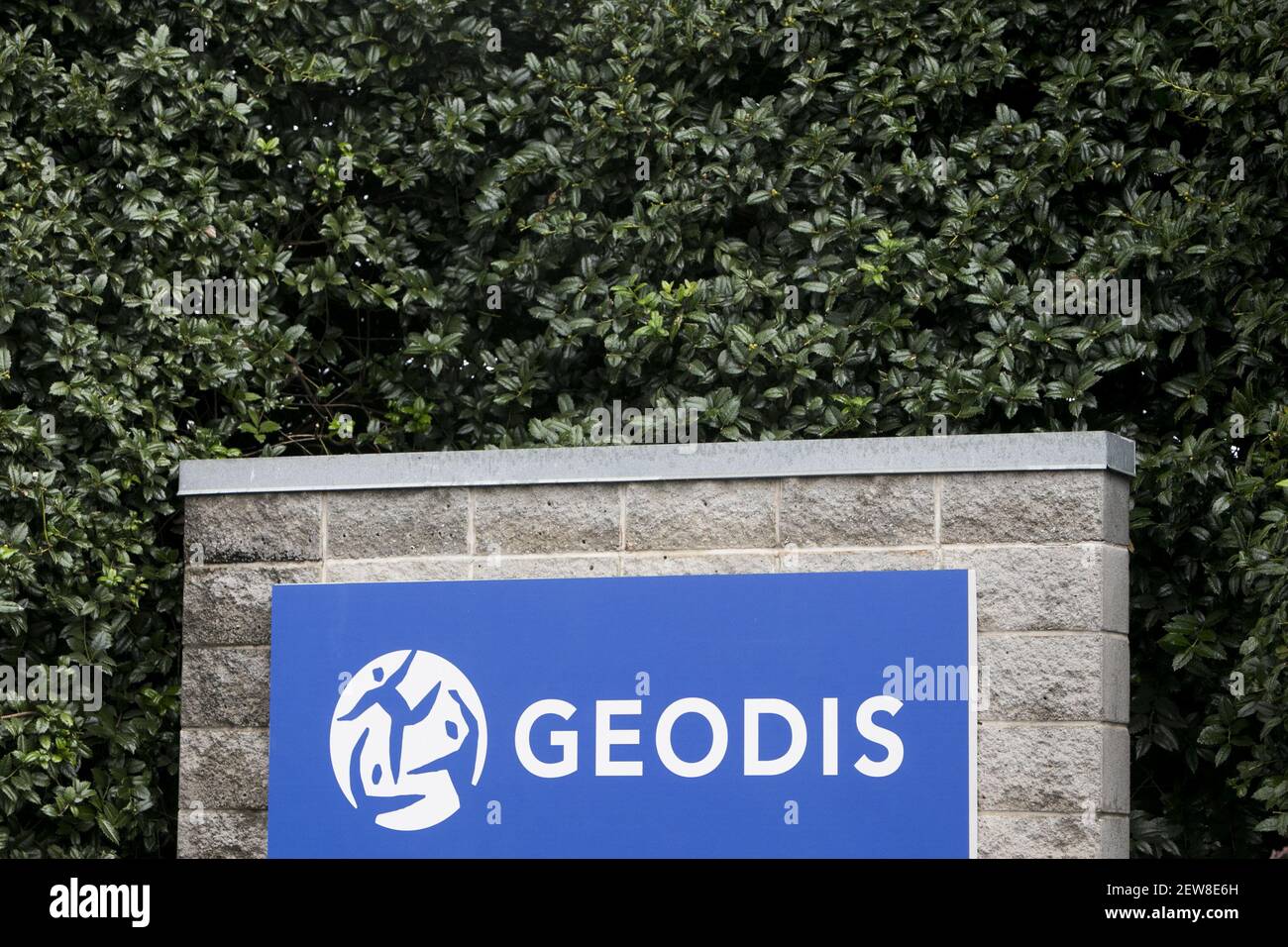 A logo sign outside of a facility occupied by Geodis in McDonough