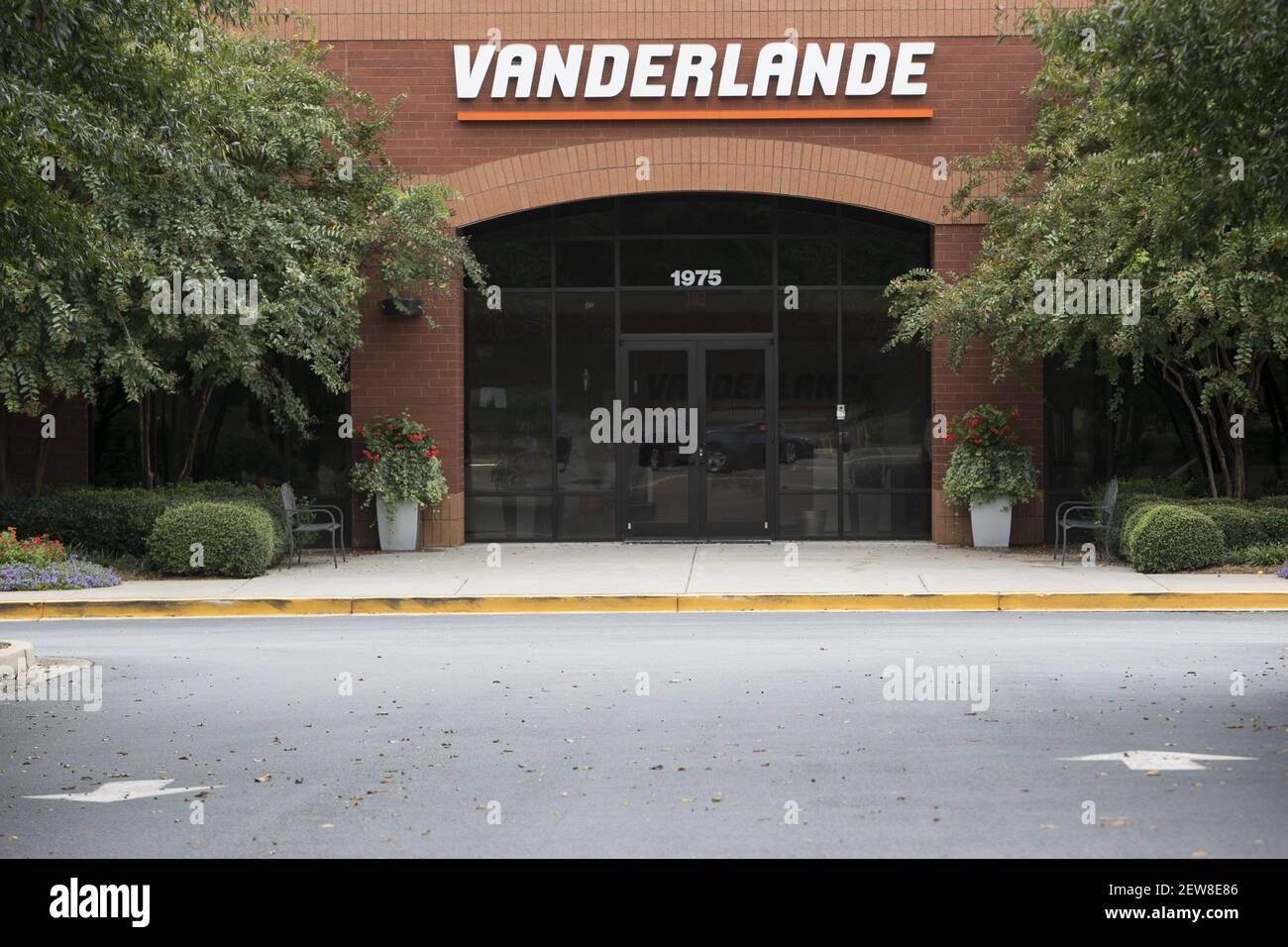 A logo sign outside of a facility occupied by Vanderlande Industries in