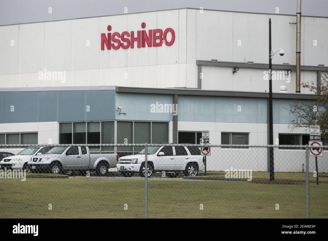 A logo sign outside of a facility occupied by Nisshinbo in Covington